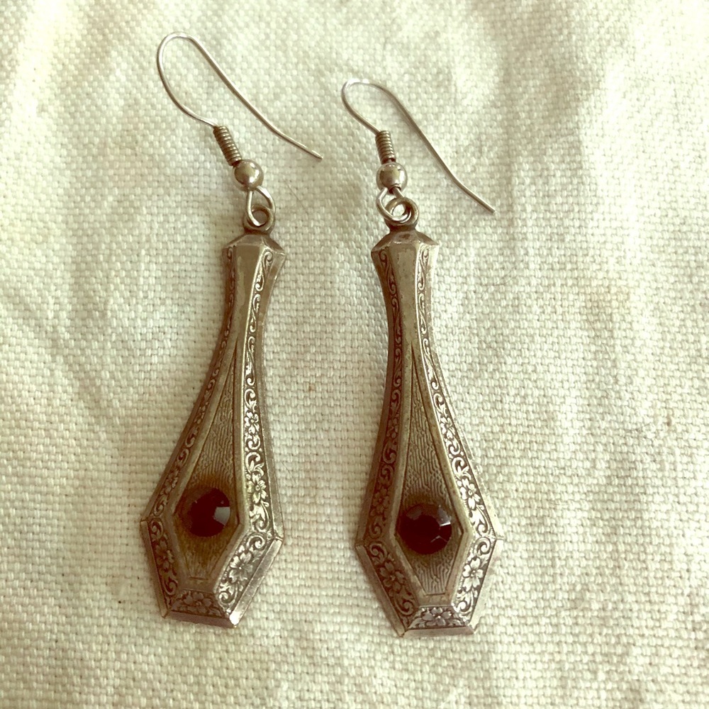 Silver Tone Dangles With Black Stone.